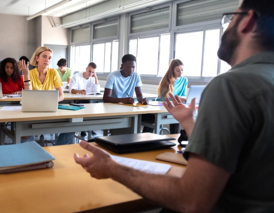 female-college-student-talking-to-professor-high-2022-09-05-20-57-40-utc-min